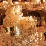 white-roses-and-high-candles-wedding-centerpiece.jpg